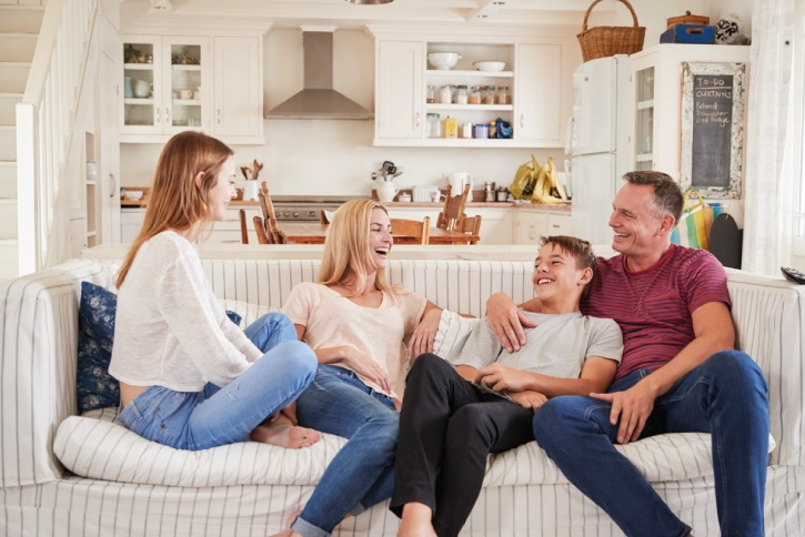 Family of four enjoying time together on their couch