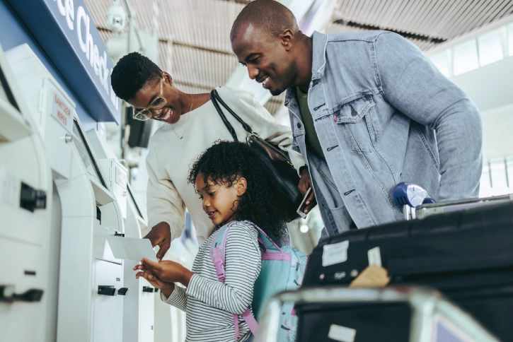 Family checking in at the airport before traveling